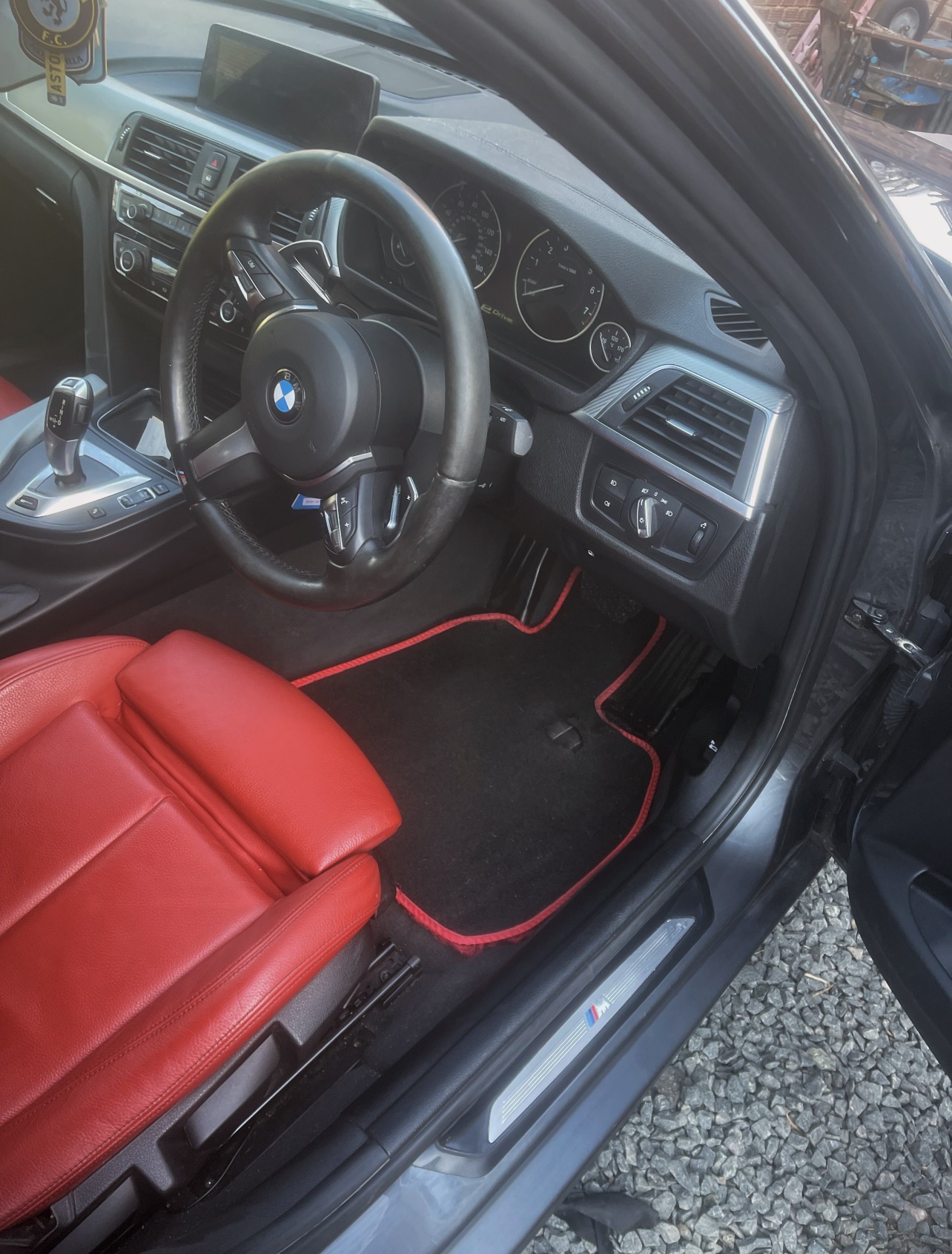 Black BMW interior with red leather seats, cleaned and detailed by SdetailE